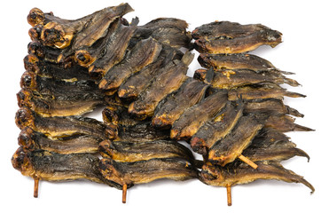 Dried clarias fishes in bamboo skewer