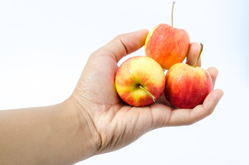 Isolated of apples in hand on white background