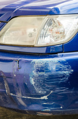 Blue bumper car scratched