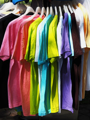 row of colorful shirt rack on clothes hanger