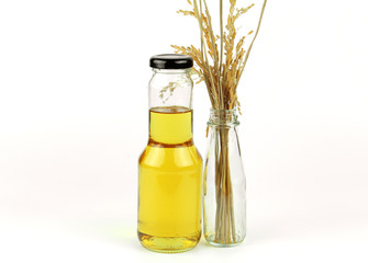 Rice bran oil in bottle glass and rice