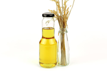 Rice bran oil in bottle glass and rice
