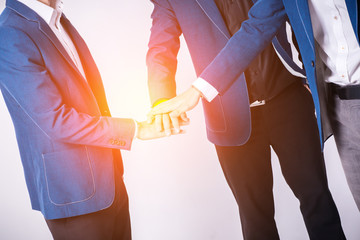 Obraz premium Team work concept. Business people joining hands.