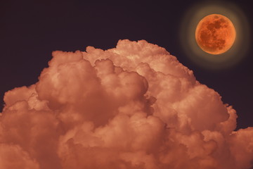 Red full moon with Red Cloud/light around the moonand dark sky.