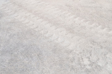 Fototapeta na wymiar Closeup surface concrete floor with tire tracks textured background