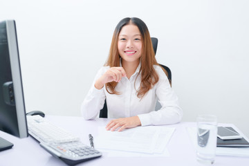 Young businesswoman working at her workplace.