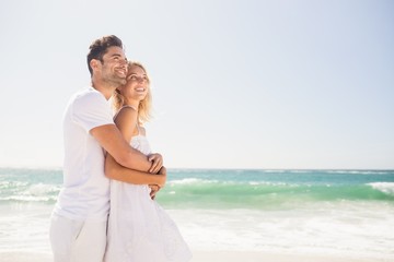 Smiling young couple hugging 