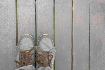 Feet concept with old brown shoes with space for text or symbol