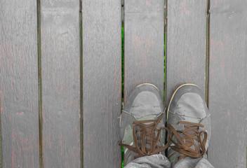 Feet concept with old brown shoes with space for text or symbol