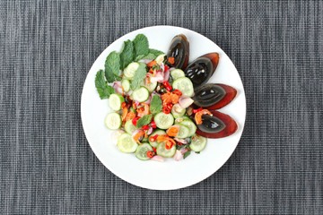 Spicy cucumber salad with dried shrimp and  preserved egg.
