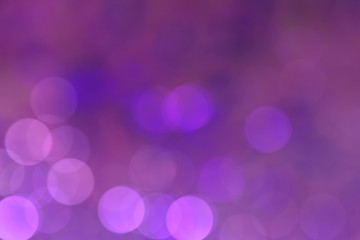 Defocused Christmas violet bokeh magic light with copy space