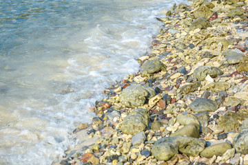wave and rock on beach