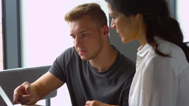 Male College Student Works One To One With Tutor Shot On R3D