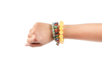 Colorful fashion bracelets on woman hand isolated on white