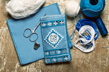 Hardanger embroidery blue and white colors with instruments