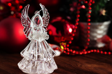 Crystal Angel on the background of Christmas balls. new Year decoration. Christmas ornaments, christmas decoration