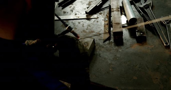 Male welder working on a piece of metal