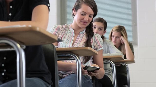 High school student texting in class 