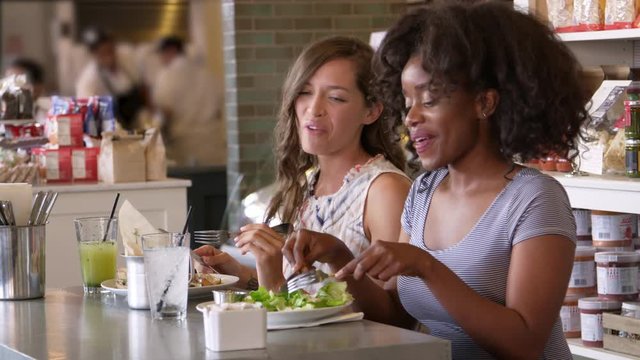 Female Friends Enjoying Lunch In Restaurant Shot On R3D