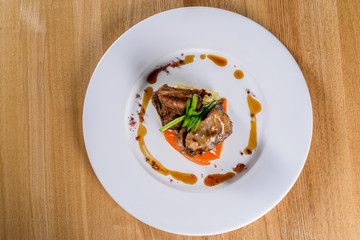 Meat on a white plate