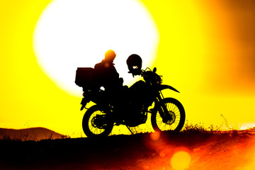 Fototapeta na wymiar silhouette of the mountain motor drive