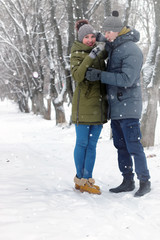 family couple walk winter snow