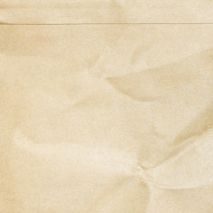 Recycled crumpled brown paper texture or paper background for design with copy space for text or image.