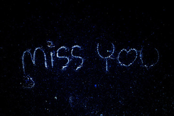 The word miss you art blue background.