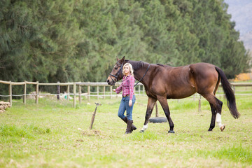 Beautiful elegance back woman cowgirl, riding a horse wearing bl