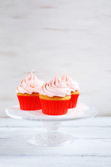 Cupcakes with cream on a stand