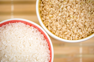 white rice and brown rice in bowl