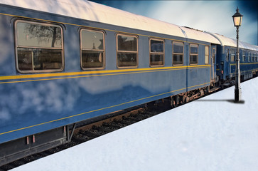 Fototapeta premium Classic train on snowy platform with lantern in winter