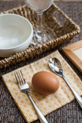 Fresh egg between fork and spoon.