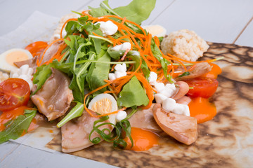 Fototapeta na wymiar Squid salad with arugula