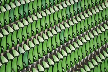 Obraz premium Seating rows in a stadium with weathered chairs