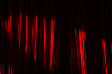 Red curtains and light.