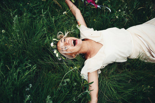 Happy smiling bride in grass