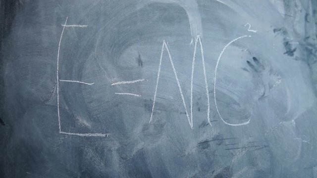 E=MC2 written on children's blackboard