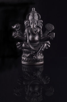 Ganesha Statue Lord of Success isolated on black background