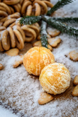 tangerines in snow on a wooden table, new year, a still life