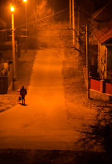Lonely silhouette on a street in night