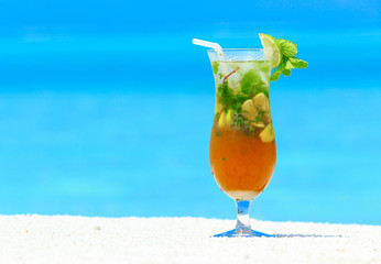 cocktail with blur beach on background
