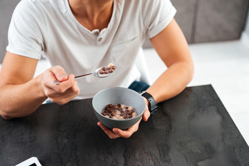 Cropped image of asian man in kitchen