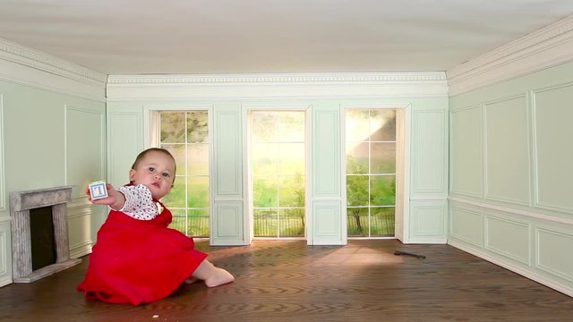 Toddler girl in tiny room with building block