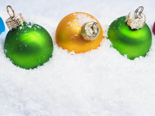 Christmas baubles in snow