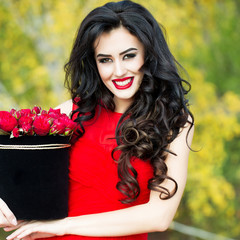 sexy smiling girl with red roses