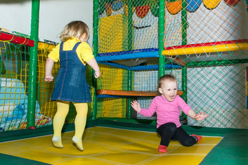 Fototapeta na wymiar The child in the entertainment center in the game maze.