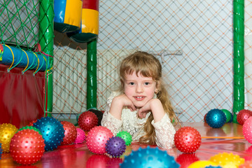 Fototapeta na wymiar The child in the entertainment center in the game maze.
