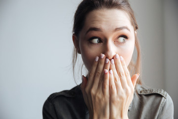 Young surprised woman in shirt