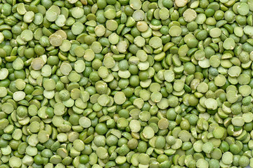 Prepared Green split peas for cooking and background